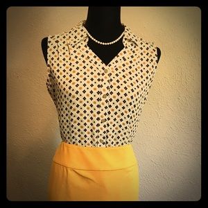 Small button up collared shirt.